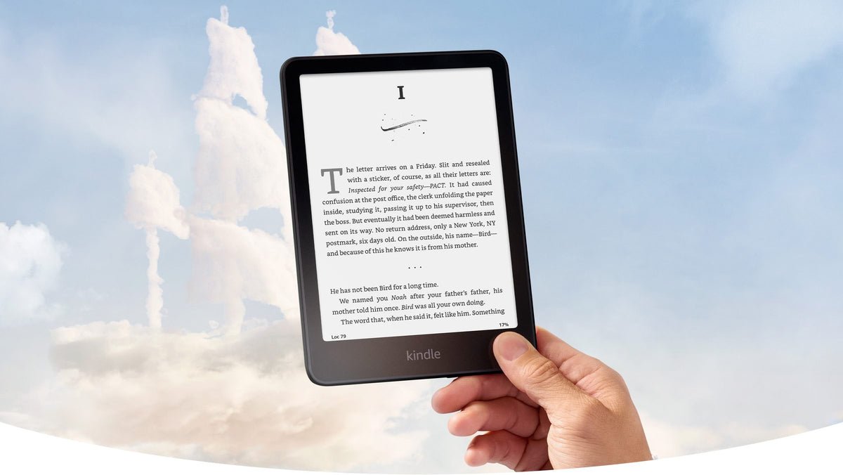 Kindle Paperwhite Signature Edition held up against the sky