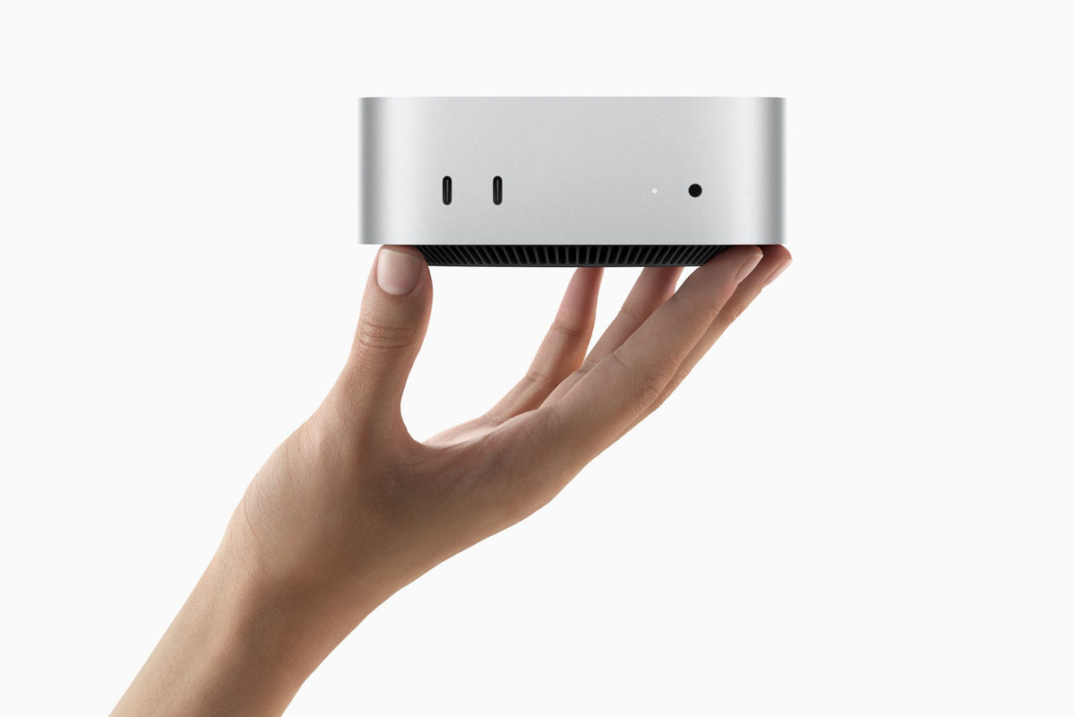 Mac mini with M4 Pro (2024) held in one hand
