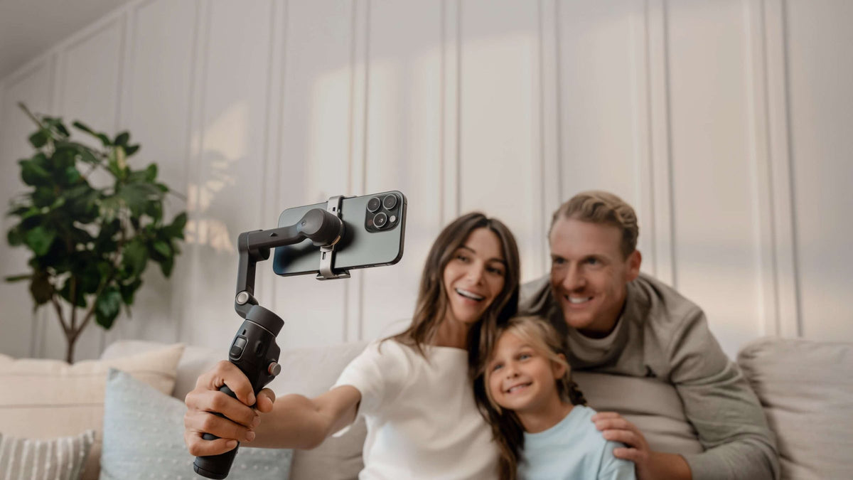 Family taking a selfie video with the DJI Osmo Mobile 8 phone gimbal