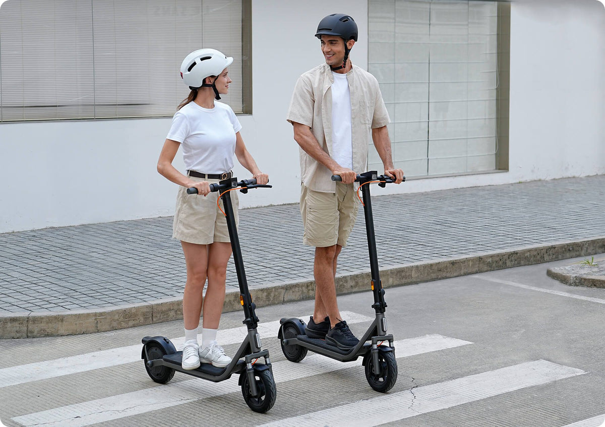 Two riders on the Xiaomi Electric Scooter 6 Lite